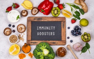 Natural immune booster foods shown together highlight how everyday ingredients like fruits, vegetables, herbs, and fermented foods support immune regulation rather than quick fixes.